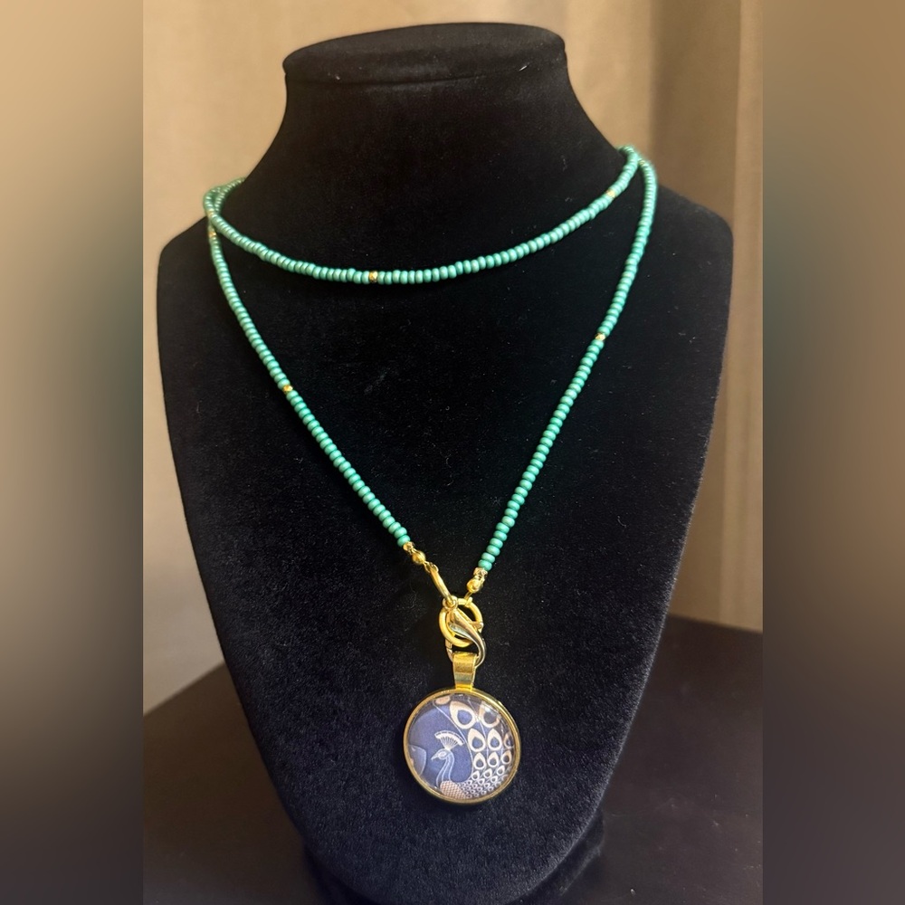 16” Turquoise beaded Necklace with Gold and Blue Peacock Pendant
